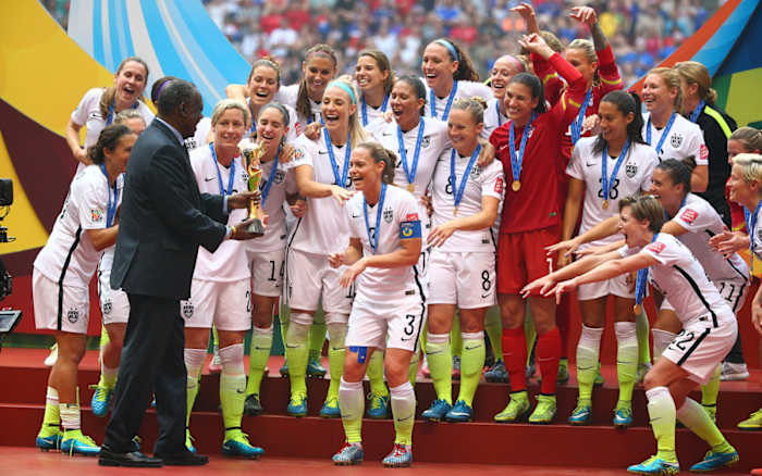rampone-receives-world-cup-trophy.jpg
